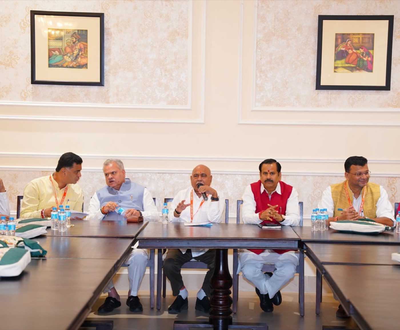 Hemant Khandelwal speaking at an organisational meeting seated with other party office-bearers