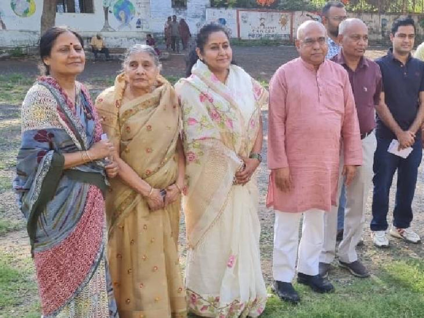 Hemant Khandelwal, at right, standing outdoors with a group of people